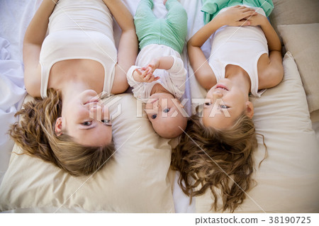 three girls sisters in the morning in the bedroom three girls sisters in the morning in the bedroom 38190725