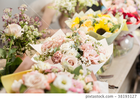Bouquets on table, florist business. Different 38193127
