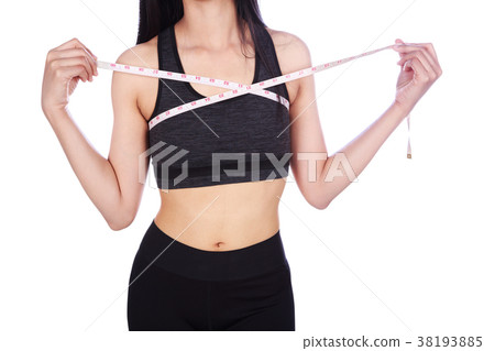 clsoe up woman is measuring her chest with measure tape isolated 38193885