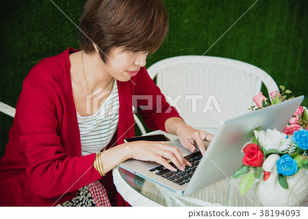 Chinese Businesswoman Working On Tablet Computer Outside Office. Chinese Businesswoman Working On Tablet Computer Outside Office. 38194093