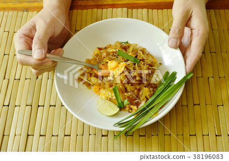 fork scooping Pad Thai stir fried rice noodles fork scooping Pad Thai stir fried rice noodles 38196083