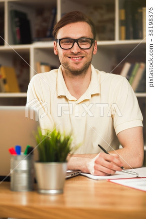 Young man with a laptop Young man with a laptop 38198376