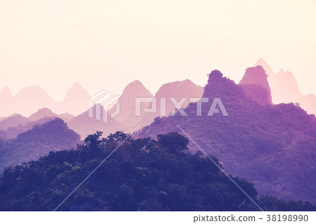 Sunset over Karst mountains formations in Guilin. 38198990