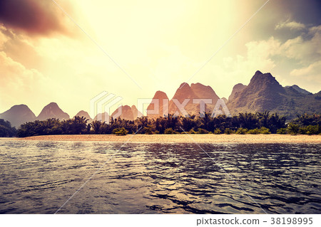 Scenic sunset over Li River. 38198995