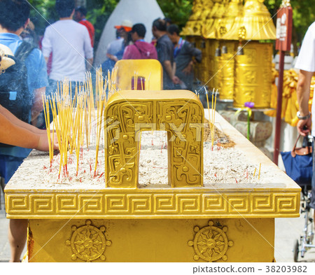 The golden candle-bar in the Buddhist temple 38203982