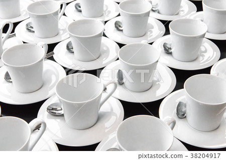 Group of ceramic white cup serving tea or coffee. Group of ceramic white cup serving tea or coffee. 38204917