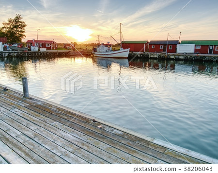 Small fishing port with boats and  moored on  sea 38206043
