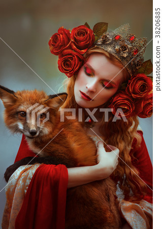 Woman in medieval clothes with a fox Woman in medieval clothes with a fox 38206885