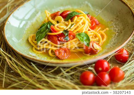 Homemade pasta with Basil and tomatoes Homemade pasta with Basil and tomatoes 38207143