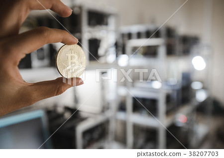 Gold coin on the background of computer devices Gold coin on the background of computer devices 38207703