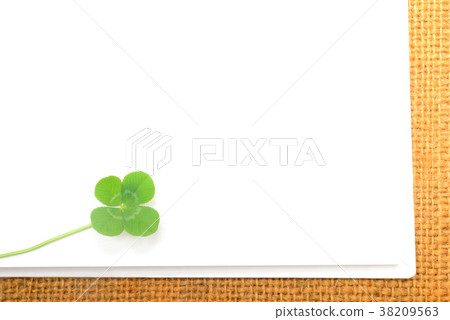 White sketchbook and four leaf clover White sketchbook and four leaf clover 38209563