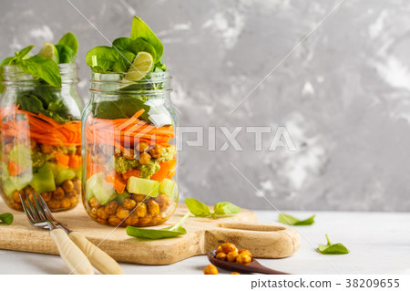 Homemade green salad in a glass jar  38209655
