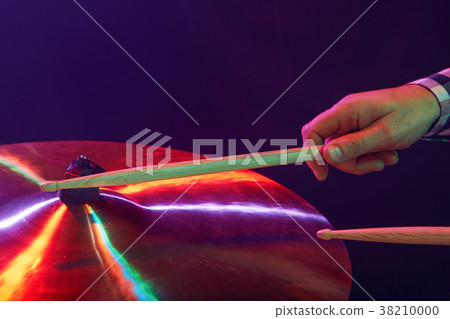 Rock band performs on stage. Guitarist, bass guitar and drums. Rock band performs on stage. Guitarist, bass guitar and drums. 38210000