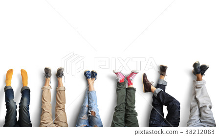 People's legs at the wall during a break in work People's legs at the wall during a break in work 38212083
