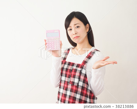 Annoyed woman holding a pink calculator 38213886