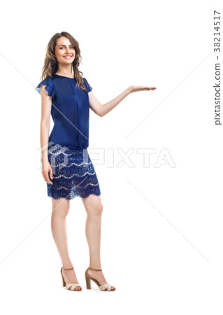 Young beautiful woman presenting isolated on white background Young beautiful woman presenting isolated on white background 38214517