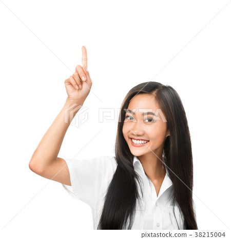 Happy smiling Asian woman pointing up and looking at camera 38215004
