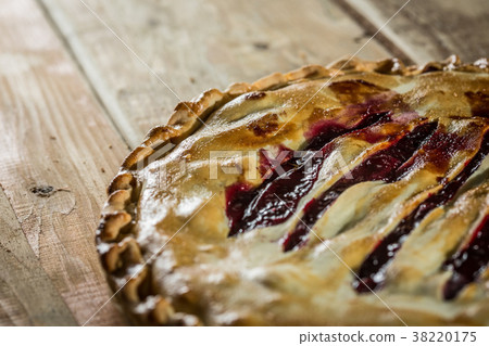 Berry pie with blueberries close-up on a plate on 38220175