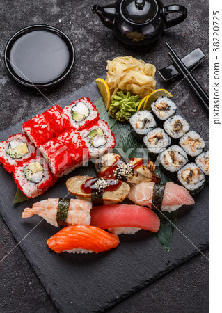 Japanese cuisine. Sushi set over dark background. Japanese cuisine. Sushi set over dark background. 38220725