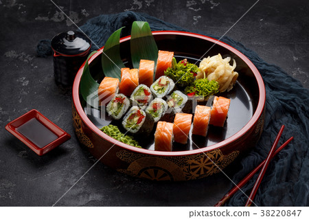 Japanese cuisine. Sushi set over dark background. 38220847