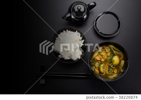 Asian soup and rice for sushi over dark background 38220874