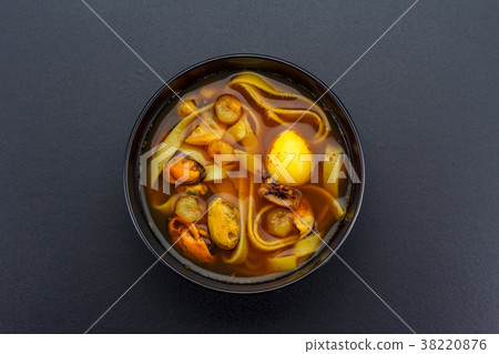 Asian soup over dark background. Asian soup over dark background. 38220876