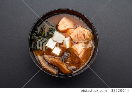 Seafood miso soup over dark table. 38220944