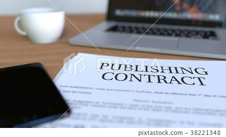 Copy of publishing contract on the desk. 3D 38221348