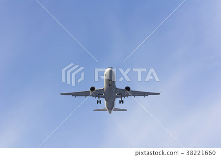 Airplane flies against a background of white cloud Airplane flies against a background of white cloud 38221660