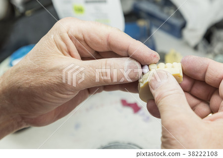 Dental Technician Works On 3D Mold Tooth Implants 38222108