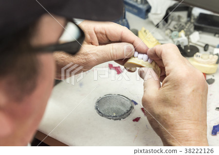 Dental Technician Works On 3D Mold Tooth Implants 38222126