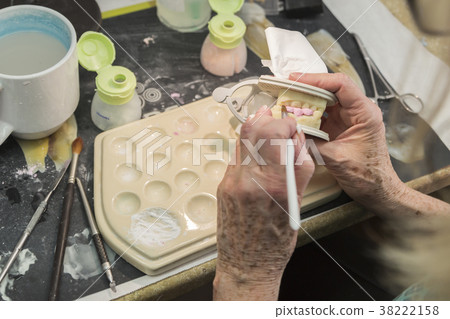 Dental Technician Works On 3D Mold Tooth Implants 38222158