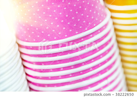 Multicolored paper cups. Bright food and drink 38222650