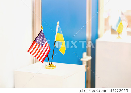 Ukrainian and USA flags stand together. Closed 38222655