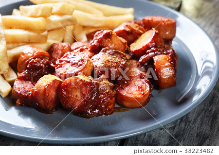 Traditional German currywurst - pieces of sausage 38223482