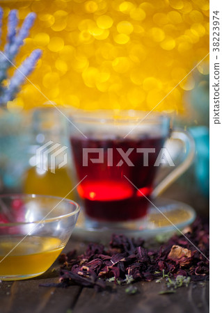 Hibiscus tea in a glass cup on a wooden background 38223974