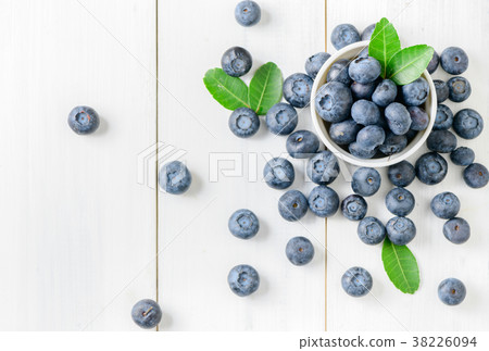 fresh blueberry fruits with leaf on white glass 38226094