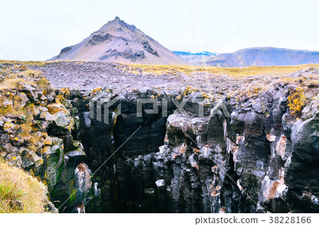 Basalt formations at the coastline in Iceland. 38228166