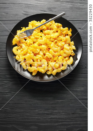 Mac and Cheese served on black plate 38229430