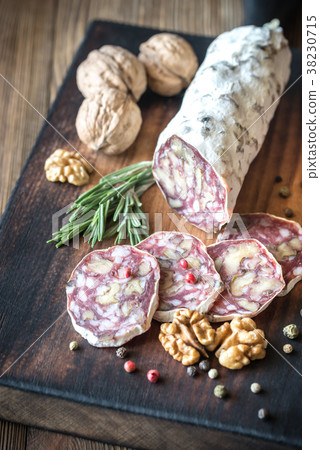 Walnut salami on the wooden board Walnut salami on the wooden board 38230715