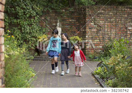 Three sisters take a walk in the park 38230742