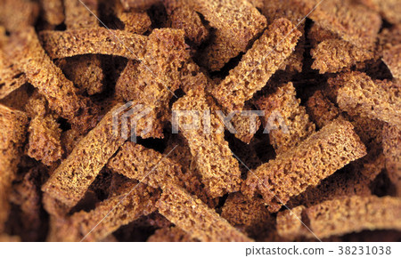 Fried croutons close up background Fried croutons close up background 38231038