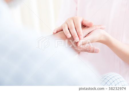 Young nurse and grandpa hold hands Hand touch Retirement home Day care center Wheelchair Young nurse and grandpa hold hands Hand touch Retirement home Day care center Wheelchair 38232974