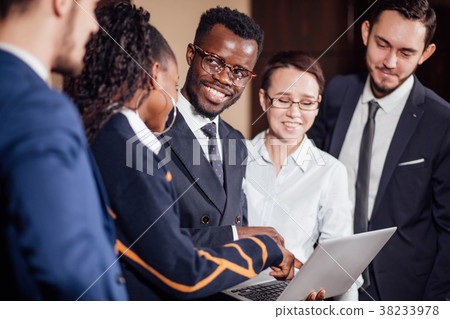 图库照片: smart business partners using laptop at meeting