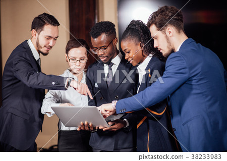 图库照片: smart business partners using laptop at meeting