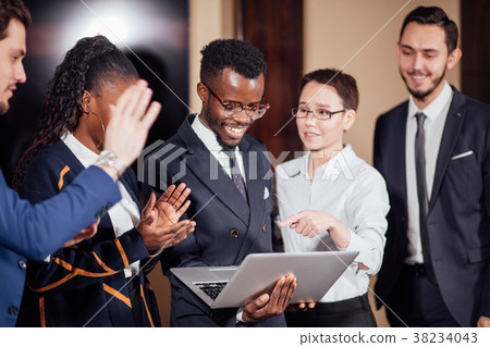 图库照片: smart business partners using laptop at meeting