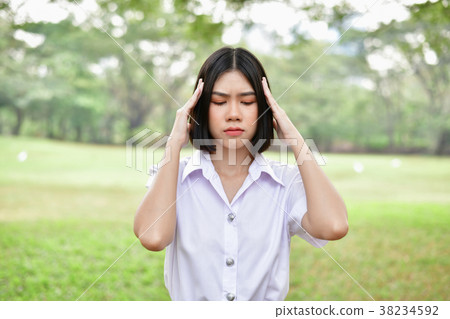 Education Concepts. Beautiful young Asian girl is thinking serio 38234592