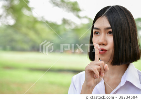 Education Concepts. Beautiful student do not say (silent). Beaut Education Concepts. Beautiful student do not say (silent). Beaut 38234594