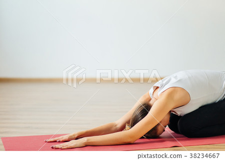 Woman doing the Child's pose. Balasana Woman doing the Child's pose. Balasana 38234667