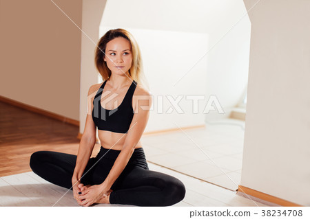 woman doing yoga exercise, sitting in baddha woman doing yoga exercise, sitting in baddha 38234708